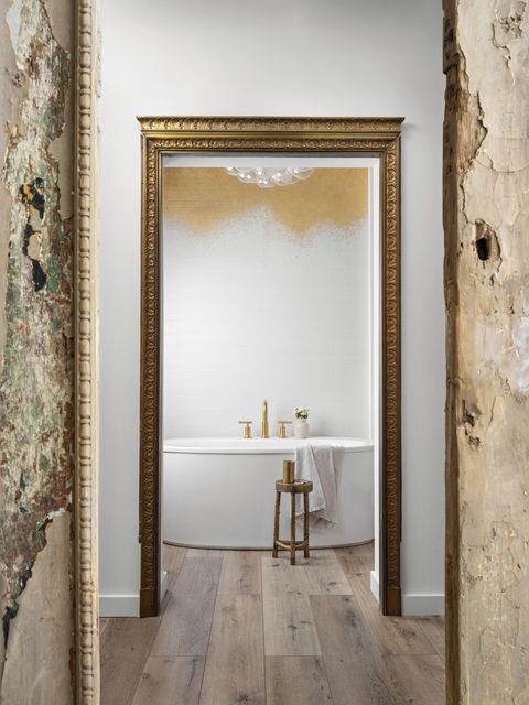 alison victoria home tour en suite bath “i wanted a real accent wall that wasn’t all paint,” victoria says of the phillip jeffries grasscloth wallcovering hand painted with 24 karat gold a solid bronze doorframe from an old elevator elegantly frames it